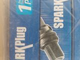 two spark plugs in the package on the table
