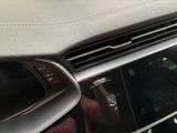 someone is taking a picture of a car dashboard with their cell phone