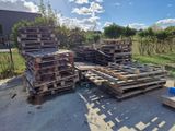 a lot of pallets that are sitting on the ground