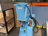 a blue machine that is sitting in a room