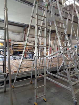 many ladders that are in a building with a lot of wood