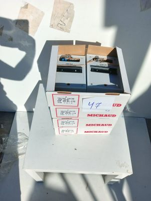 two boxes of electronic equipment sitting on top of a table
