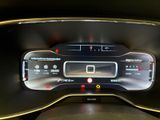 the dashboard of a car with a digital display in the center