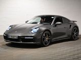 the porsche 911 gts is parked in a large room