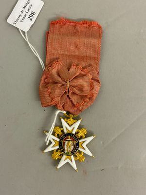 une image représentant une médaille ornée d'un ruban et d'une étoile