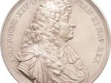 an image of a silver coin with a portrait of a man on it