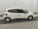 a picture of a small white car parked in a garage