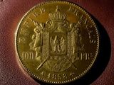 a close up of a coin sitting on top of a brown wallet