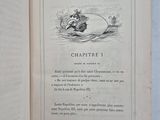 an open book with a picture of a man riding a horse on it