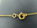 a close up of a gold chain bracelet on a mannequin mannequin mannequin mannequin mannequin mannequin mannequin mann