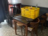 a table and chairs in a room with a yellow box on it