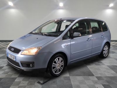 an image of a blue car parked in a garage