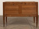 an old wooden chest sitting on top of a hard wood floor