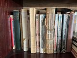many books that are on a book shelf together