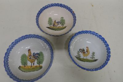 three bowls with pictures of animals on them sitting on a table