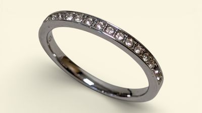 a close up of a diamond ring on a white background