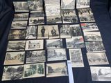 a lot of old black and white photos on the table