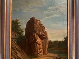 peinture sur le mur d'une pièce où l'on voit un homme assis sur un rocher