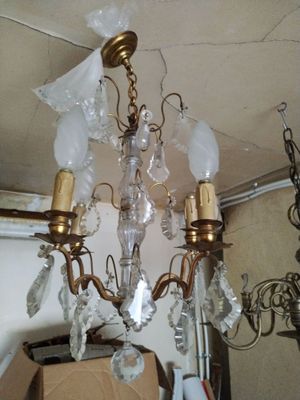 a chandelier that has a lot of glass hanging from it