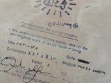 a certificate on a piece of paper with a drawing of a sun