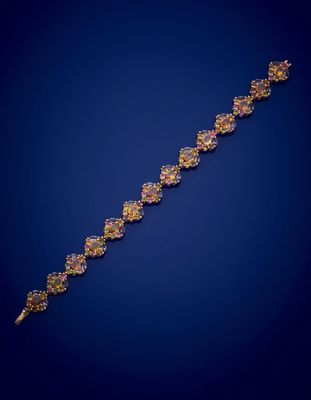 BRACELET en vermeil rose (925‰) composé de quatorze motifs s…