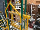 a pile of assorted construction equipment in a garage