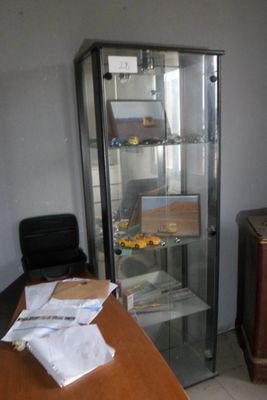 an image of a room with a refrigerator and a television