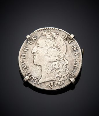 Pièce en argent avec la tête d'une femme de profil