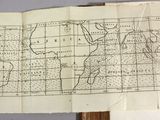 an open book with a map of the world on top of it
