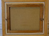 an old picture frame with a burlock canvas and a wood frame