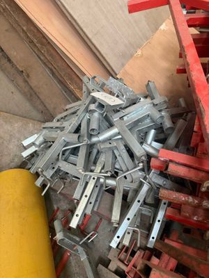 many pieces of metal that are sitting on the floor