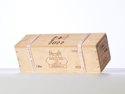 a wooden box with a label on it sitting on a table