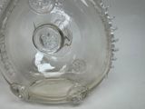 a clear glass bottle with a clock inside of it