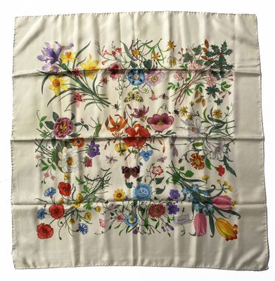 an image of a white handkerchief with colorful flowers on it