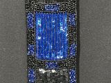 blue and black beaded bracelet with square beads on a gray surface