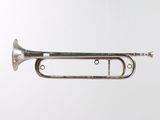 an old trumpet hanging from the ceiling on a white background