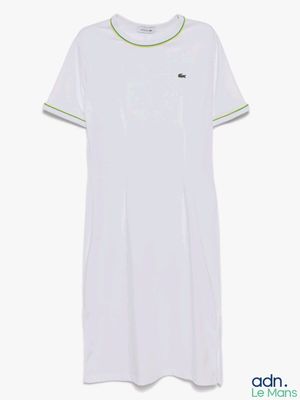 a white t - shirt with a green stripe on the chest