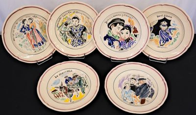 six plates with different designs on them on a black surface