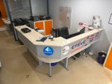 an image of an office with a desk and a computer
