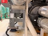a machine that is sitting in a building with a lot of pipes