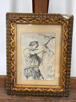 un vieux cadre contenant le dessin d'une femme en robe