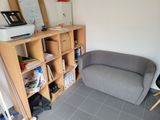 a couch and a chair in the corner of a room