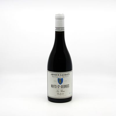 a bottle of wine that is sitting on a table