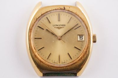 an image of a close up of a wrist watch on a white surface