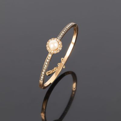 Bracelet jonc articulé en or rose (750‰) orné d'une perle de… - Photo 1