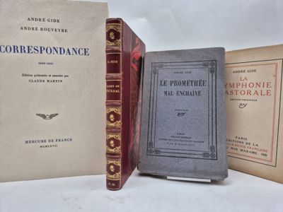 three books sitting on top of a table next to each other