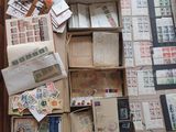 many boxes of mail sitting on the floor next to each other