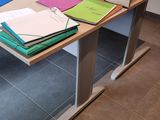 a desk that has a bunch of folders on it