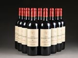 six bottles of red wine are lined up in a row