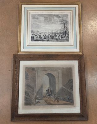 two framed pictures hanging on the wall of a room
